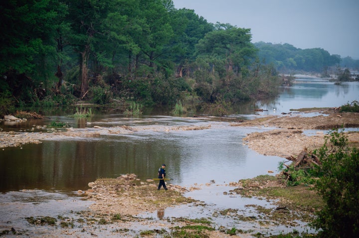 A man conducts a search near the Guadalupe River in Kerrville, Texas on Sunday after devastating floods swept through Central Texas on Thursday.