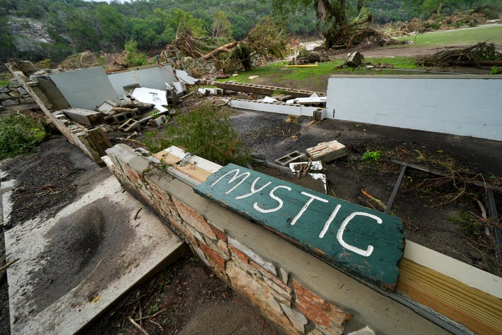 A Camp Mystic sign is seen near the entrance to the establishment along the banks of the Guadalupe River on Saturday.