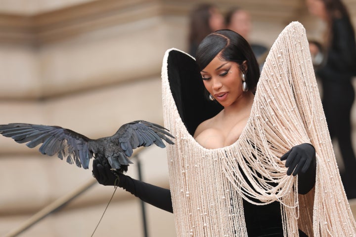 Cardi B Holds Stay, Flapping Crow On Her Arm In Wild Paris Couture Week Look - The Boston Courier 2 The bird appeared to almost take flight at one point.