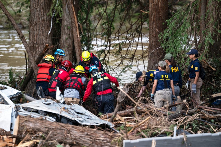 A crew of firefighters aid in search and rescue efforts near the Guadalupe River in Ingram, Texas, on Monday after a flash flood swept through the area. qhiukiuiqkeinv