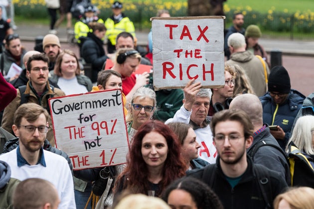 Demonstrators stage a rally outside the Treasury in March.