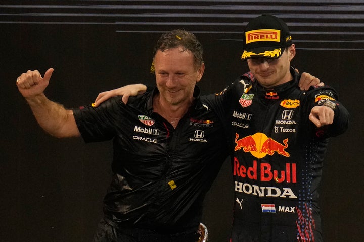 Red Bull team chief Christian Horner celebrates with his driver Max Verstappen of the Netherlands celebrates after he became the world champion after winning the Formula One Abu Dhabi Grand Prix in Abu Dhabi, United Arab Emirates, Sunday, Dec. 12, 2021.