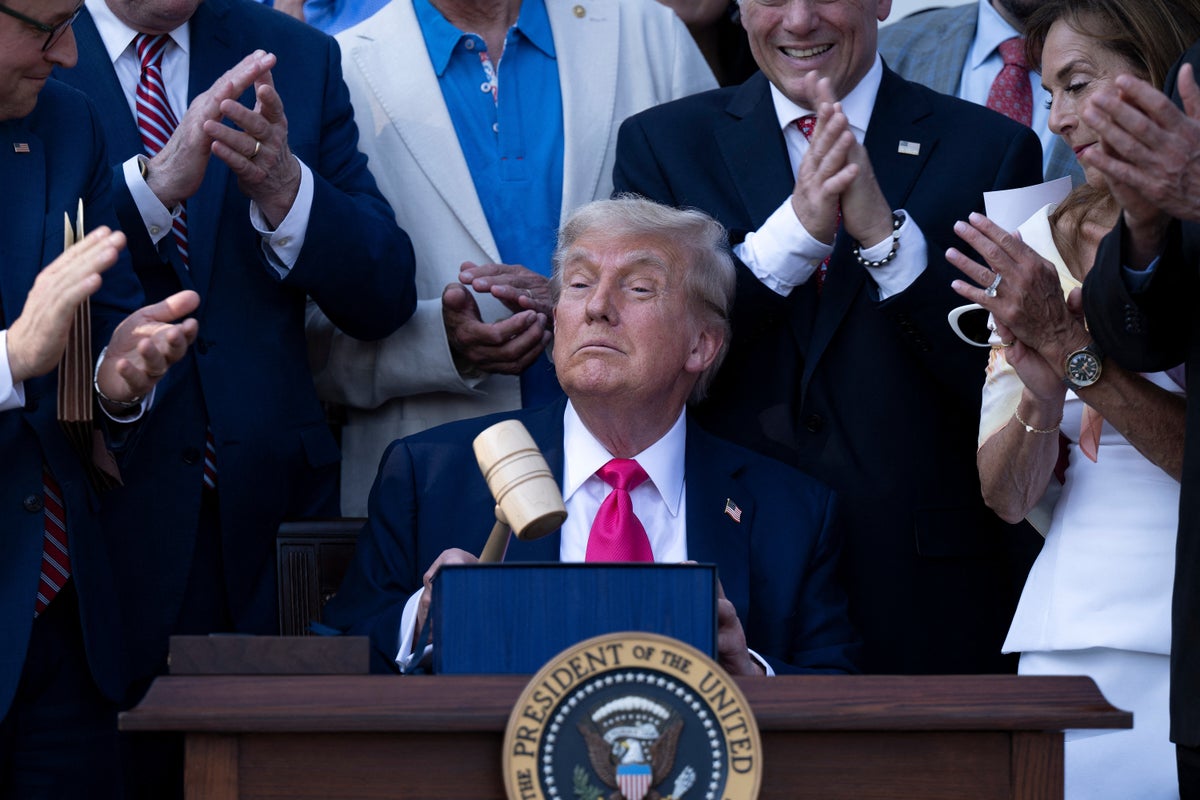 President Donald Trump holds a gavel after signing the "Big Beautiful Bill Act" at the White House in Washington, DC, on July 4, 2025.