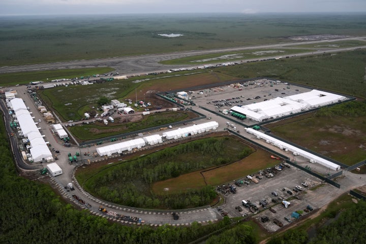 Work progresses on a new migrant detention facility dubbed "Alligator Alcatraz," at Dade-Collier Training and Transition facility in the Florida Everglades, Friday, July 4, 2025, in Ochopee, Fla. (AP Photo/Rebecca Blackwell)