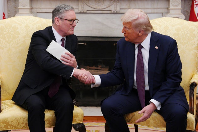 Starmer handing over the invitation letter to Trump in February.