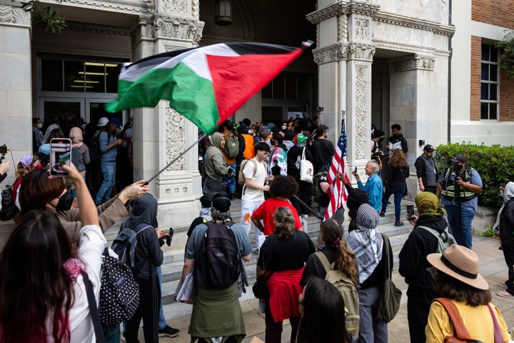 A pro-Palestinian protester holds a Palestinian flag in a demonstration at the University of California Los Angeles on May 23, 2024 in Los Angeles -- a city President Trump has spoken ill of a number of times.