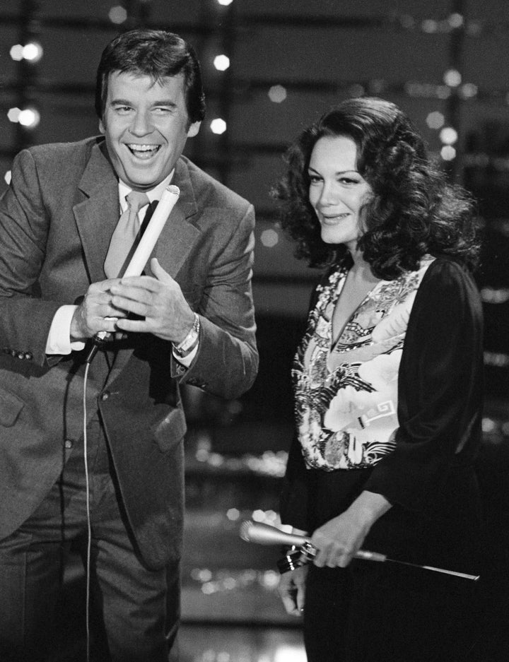 In this Dec. 9, 1980 file photo, Dick Clark, host of American Bandstand, left, appears with Connie Francis during taping of the show in Los Angeles. (AP Photo/Reed Saxon, File)