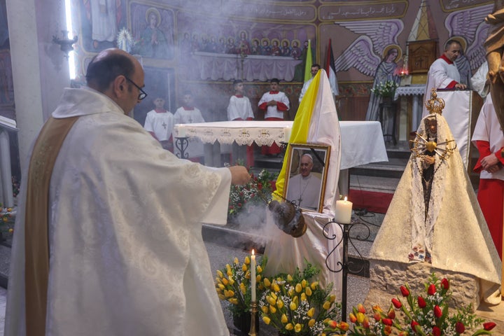 Israel Bombs Gaza's Solely Catholic Church, Killing At Least 3 And Wounding Parish Priest 2 Members of the clergy hold mass for late Pope Francis at the Holy Family Catholic Church in Gaza City on April 21, 2025. An Israeli airstrike hit Gaza's only Catholic church on July 17, 2025, killing at least three people and wounding several more, including the parish priest who spoke regularly with Francis.