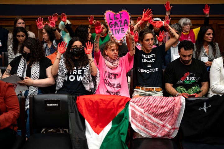 Pro-Palestinian demonstrators raise their red-painted hands before a House Judiciary subcommittee meeting on May 15, 2024, in Washington, D.C.