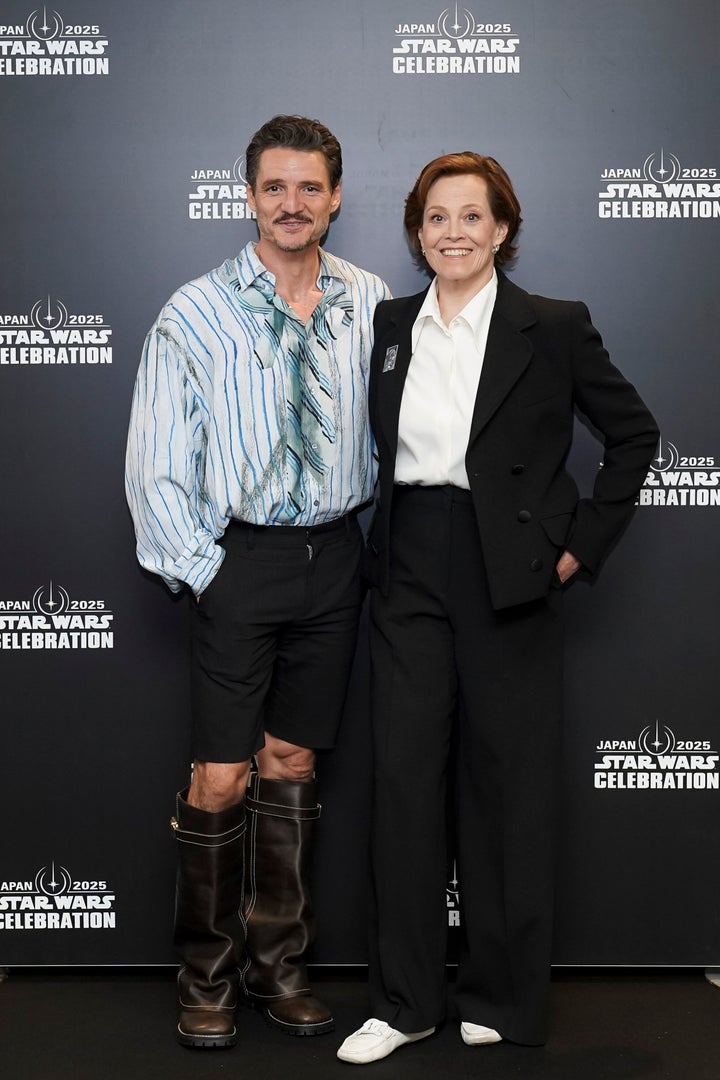 Pedro Pascal (left, with Sigourney Weaver) drew criticism for this Julia Ragolia-styled outfit, worn at a "Star Wars" event in Japan. 