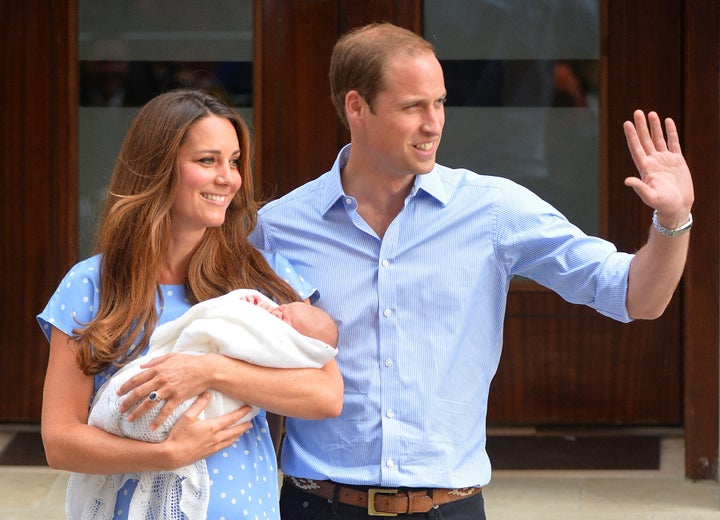 The real couple presents their baby to the world media outside the cute wing of the St Mary's hospital in London on July 23, 2013.