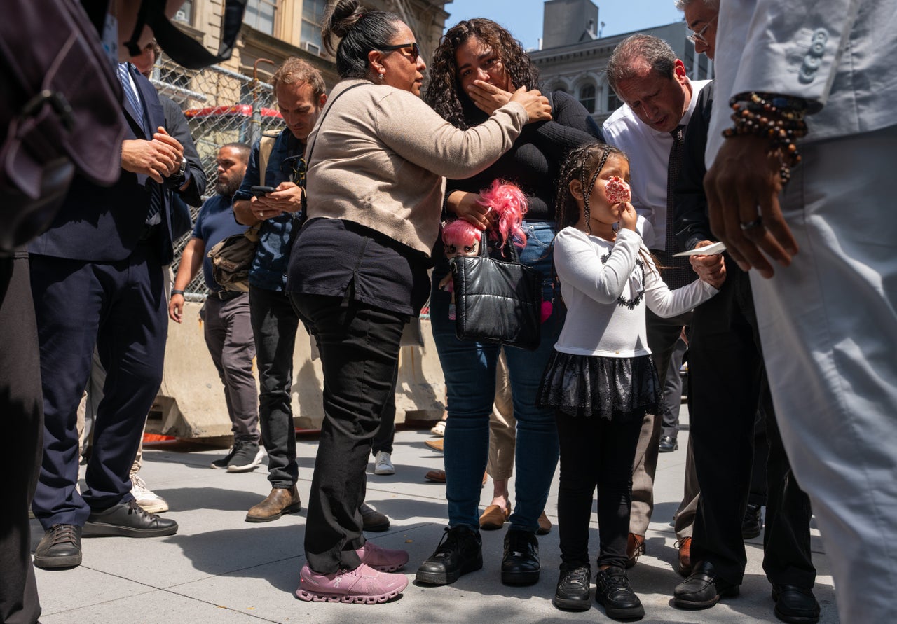 A woman grieves while standing with her daughter after her partner was taken into custody by federal agents at an immigration court at the Jacob K. Javits Federal Building on July 8, 2025 in New York City. Various council members and a state senator attended immigration hearings and observed Immigration and Customs Enforcement as they continued their stepped-up tactics of detaining people during routine check-ins or showing up to court for their immigration hearings.
