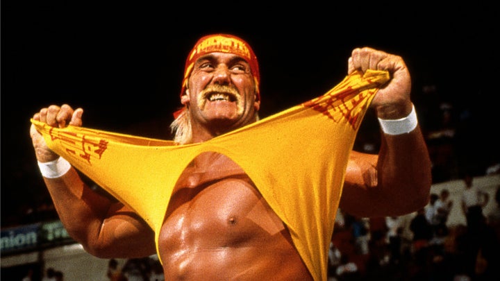Hulk Hogan makes his entrance during a match in Connecticut while with the WWE on July 28, 1991. The retired pro wrestler died Thursday.