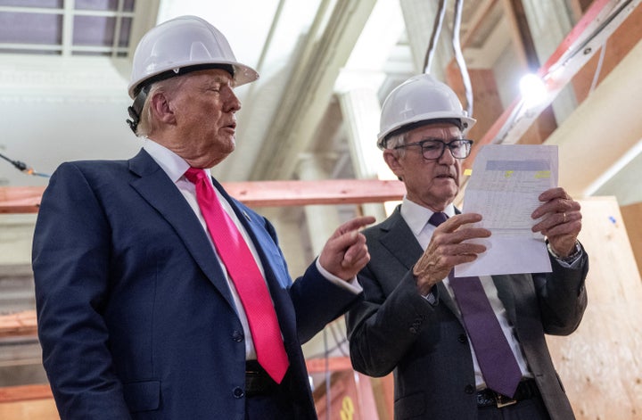 President Donald Trump and Federal Reserve Chair Jerome Powell confer during the president's visit to the Federal Reserve on July 24, 2025.