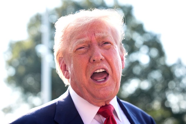 President Donald Trump speaks with reporters before departing on Marine One from the South Lawn of the White House, Friday, July 25, 2025.