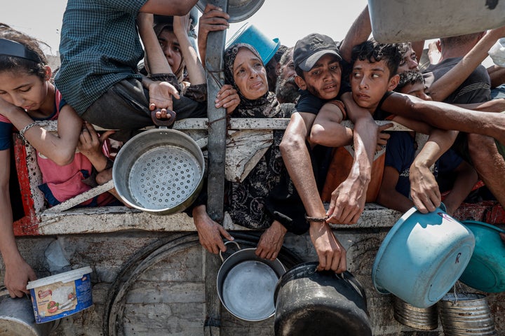 Israeli Gunshots And Strikes Kill At Least 42 In Gaza, Some Whereas In search of Support 2 Palestinians wait in queue to get hot meals distributed by aid organizations in Gaza City, Gaza on July 26, 2025. (Photo by Khames Alrefi/Anadolu via Getty Images)