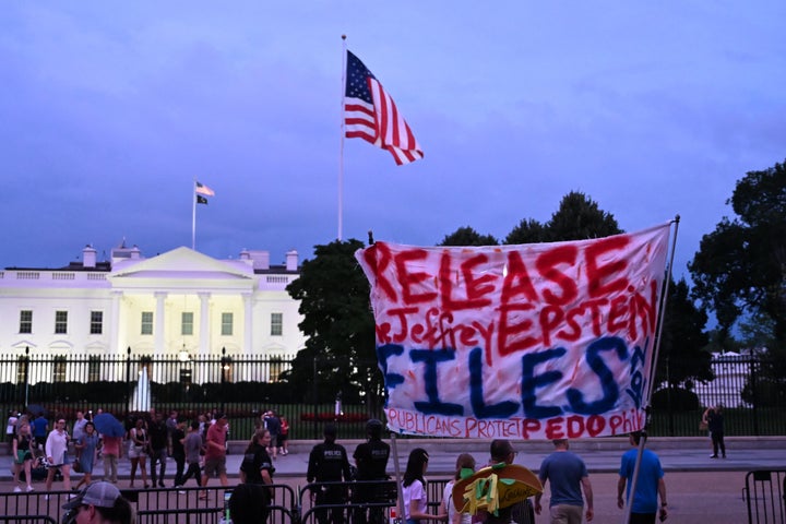 A protester holds a sign outside the White House demanding the release to all files related to Jeffrey Epstein. The issue has proven to be a surprisingly long-lasting political problem for the president.
