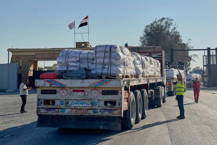 Israel Begins Every day Pause In Preventing In 3 Gaza Areas To Enable 'Minimal' Help As Starvation Grows 1 Trucks carrying humanitarian aids enter the Rafah crossing between Egypt and the Gaza Strip, Sunday, July 27, 2025. (AP Photo/Mohamed Arafat)