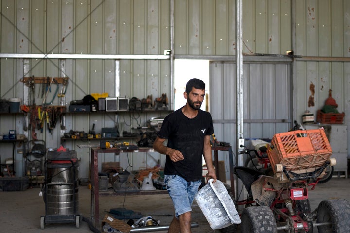 Yinon Levi photographed working on his farm in 2024.