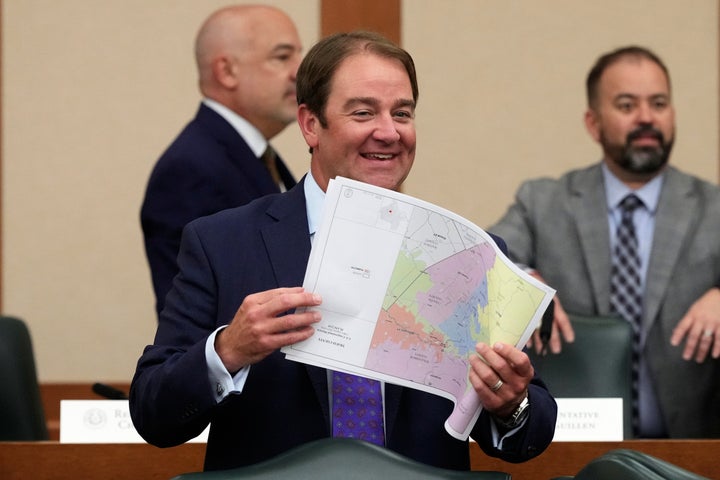 Republicans Gerrymander The Hell Out Of Texas And Eradicate 5 Democratic Seats 1 Texas state Rep. John McQueeney looks through U.S. Congressional District maps during a redistricting hearing at the Texas Capitol on July 24 in Austin, Texas.