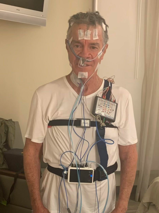 The author undergoing a sleep study at the Stanford Sleep Medicine Sleep Laboratory in 2010. 