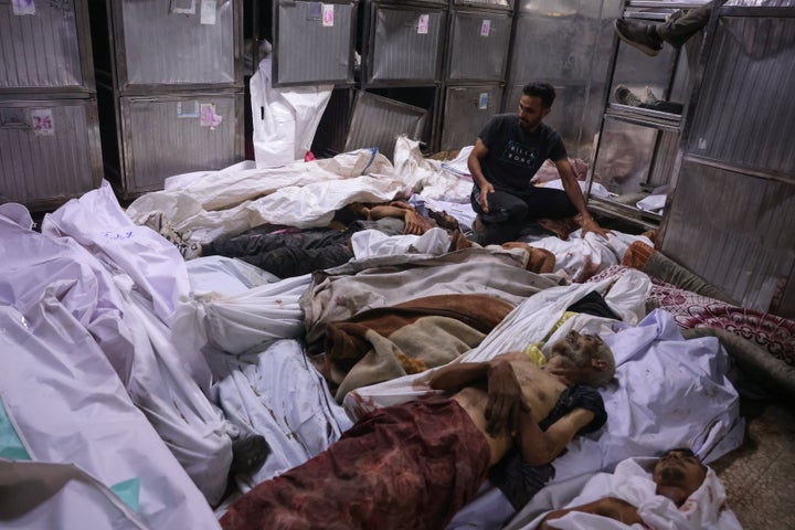 'Nothing Is Going To Purchase My Soul': GHF Whistleblower Reveals Horrors In Gaza 1 Palestinians check bodies of people killed while waiting for aid a day earlier, at the Al-Shifa Hospital's morgue in Gaza City, on July 31, 2025. Gaza's civil defense agency said Israeli forces killed at least 30 people when they opened fire on a crowd waiting for humanitarian aid on July 30.
