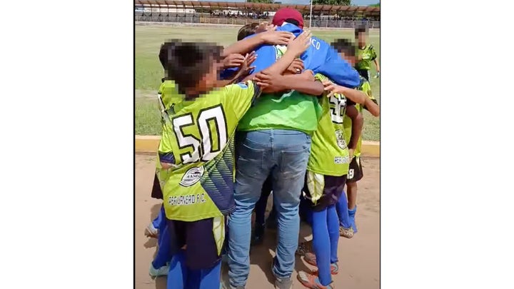 Jerce Reyes Barrios, a soccer coach, reuniting with young soccer players after returning to Venezuela