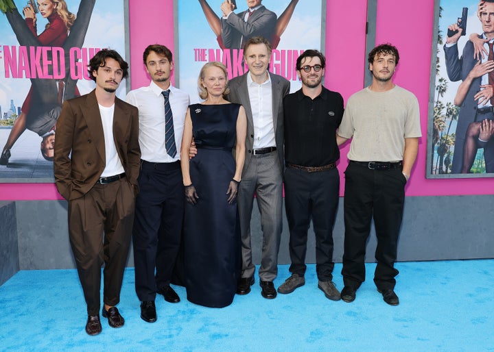 Anderson’s sons, Dylan Jagger Lee and Brandon Thomas Lee (L) and Neeson’s sons, Daniel Neeson and Micheál Neeson (R), pose with their parents at "The Naked Gun" New York premiere Monday.