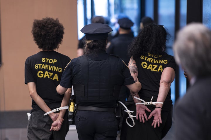 NYPD officers arrest activists following a civil disobedience protest at U.S. Senator Chuck Schumer's office building in Manhattan, New York on Aug. 1, 2025. The protest called for a ceasefire and an end to the U.S.-supported Israeli attacks on Gaza. (Photo by Mostafa Bassim/Anadolu via Getty Images)