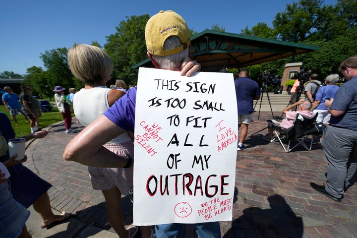 A local resident listens to a speech during a rally held by the Iowa Democratic Party, on July 3, 2025, in Windsor Heightts, Iowa.