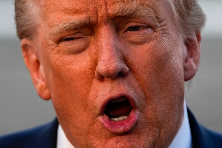 President Donald Trump speaks with reporters at Lehigh Valley International Airport on Aug. 3, 2025.