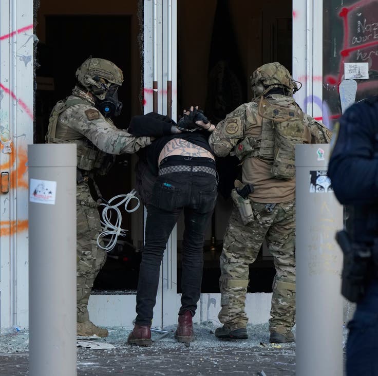 Customs and Border Protection detains a man outside an Immigration and Customs building during a protest in Portland, Oregon, June 14, 2025.
