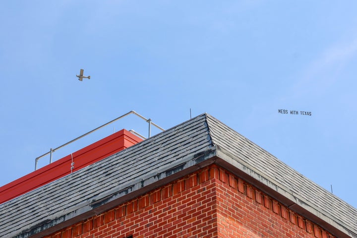 Planes Flying A Daring 3-Phrase Message For Texas Have Been Noticed Over Liberal State Capitals 2 A view of the plane and sign flying in Annapolis.
