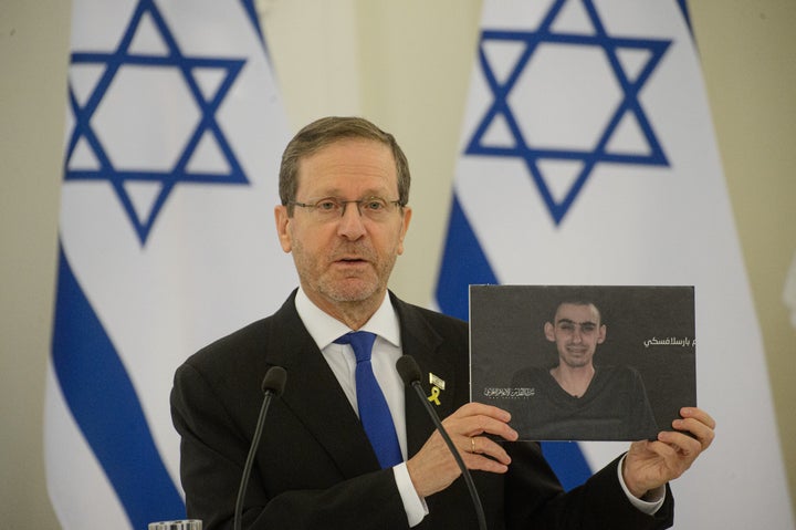 Israeli Navy Chief Opposes Netanyahu Plan To Develop Gaza Occupation 1 Israeli President Isaac Herzog shows photos of hostages held by Hamas after meeting with Lithuanian President Gitanas Nauseda, in Vilnius, Lithuania on Aug. 4, 2025.