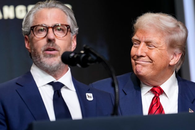 Casey Wasserman, chair of the 2028 LA Olympics organizing committee, left, and US President Donald Trump 