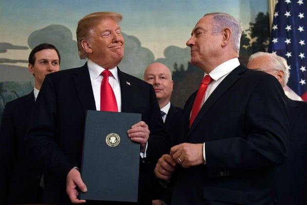 President Donald Trump smiles at Israeli Prime Minister Benjamin Netanyahu, right back in 2019.