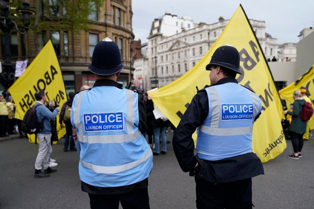 Police patrol a protest by 'Not My King' demonstrators near the route to be take by Britain's King Charles III coronation procession in London, Saturday, May 6, 2023. 