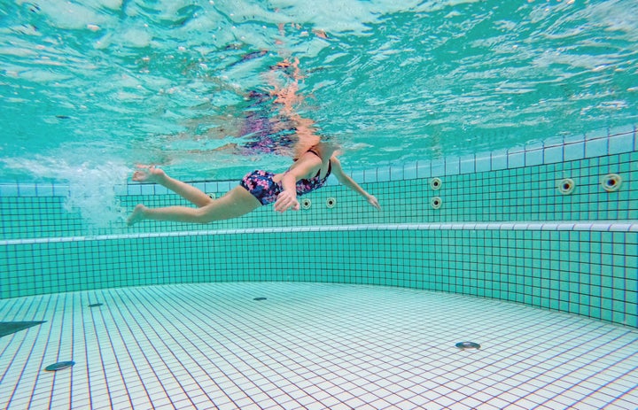 The more the organic matter in the pool, the more the chloramines are produced (which include pee, as well as sweat and shit particles).