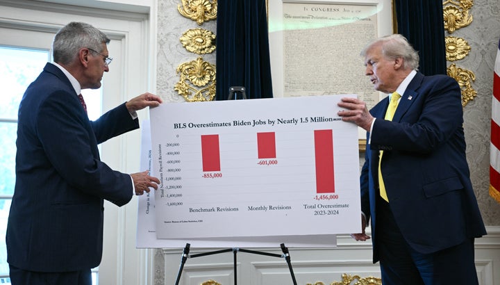 U.S. President Donald Trump (R) and economist Stephen Moore (L) speak about the economy in the Oval Office of the White House on Aug. 7, 2025, in Washington, D.C.