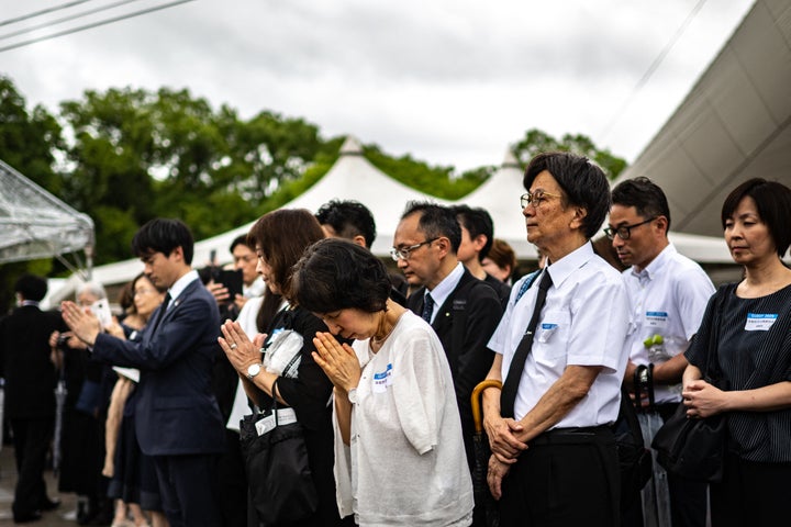Nagasaki Marks eightieth Anniversary Of U.S. Atomic Bomb Assault 2 People pray after the annual memorial ceremony for the victims at the Peace Park in Nagasaki on August 9, 2025, to mark the 80th anniversary of the atomic bombing during WWII. (Photo by Philip FONG / AFP via Getty Images)