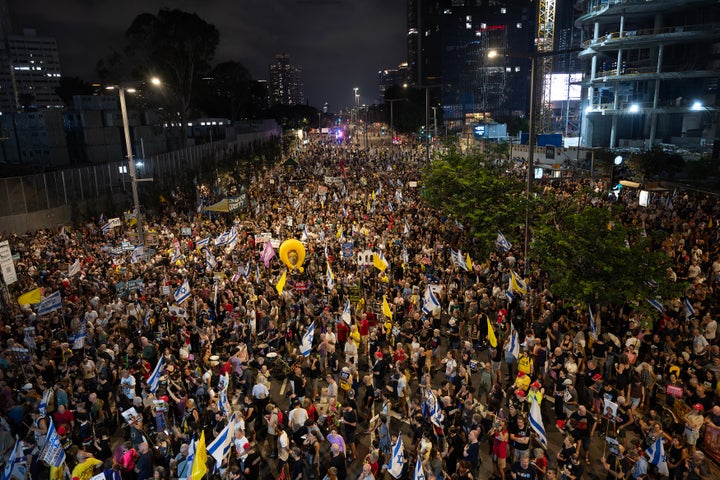 Crowds of Israelis join the families of hostages in a demonstration demanding their government agree to a ceasefire deal that releases all remaining captives from Hamas, and that ends the military offensive and any occupation in Gaza. After the rally, the protesters marched around the Kirya base in Tel Aviv, on Aug. 9, 2025.
