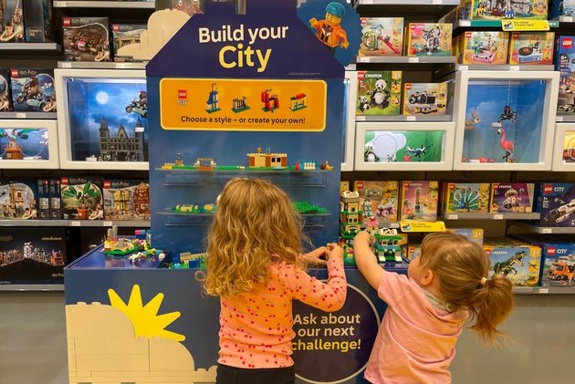 Kids playing with Lego in store.