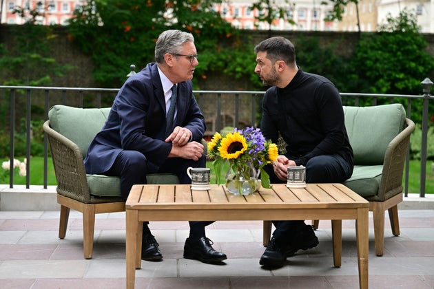 Keir Starmer, left, talks with Ukraine's President Volodymyr Zelenskyy in the garden of 10 Downing Street in London, Thursday Aug. 14, 2025.
