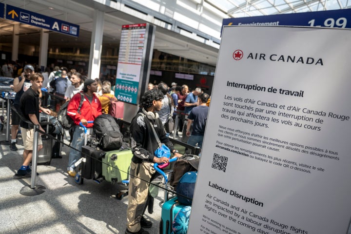 STRIKE: Air Canada Grounds Planes After Flight Attendants Stroll Off The Job 1 Passengers wait in line to speak to Air Canada representatives to see if they can reschedule flights at the Pierre-Elliott Trudeau Airport in Montreal, Quebec, Canada, on August 15, 2025. (Photo by ANDREJ IVANOV/AFP via Getty Images)