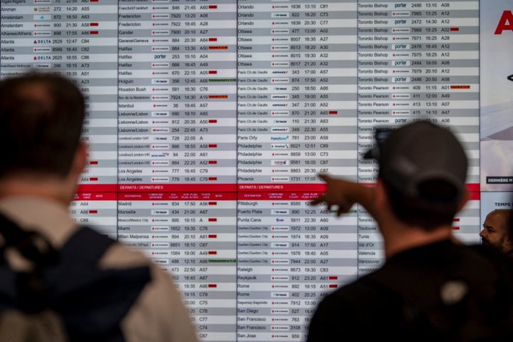 STRIKE: Air Canada Grounds Planes After Flight Attendants Stroll Off The Job 2 A flight board is seen at the Pierre-Elliott Trudeau Airport in Montreal, Quebec, Canada, on August 15, 2025. (Photo by ANDREJ IVANOV/AFP via Getty Images)