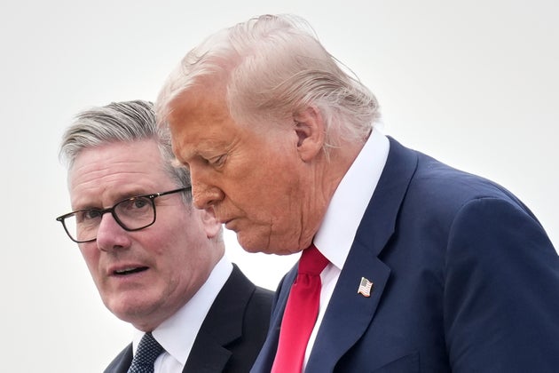 President Donald Trump and Britain's Prime Minister Keir Starmer exit Air Force One as they arrive at Royal Air Force Lossiemouth en route to Aberdeen, Scotland Monday, July 28, 2025. (AP Photo/Jacquelyn Martin)