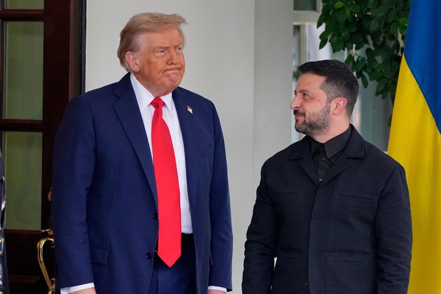 President Donald Trump, left, greets Ukraine's President Volodymyr Zelenskyy as he arrives at the White House, Monday, Aug. 18, 2025, in Washington. 
