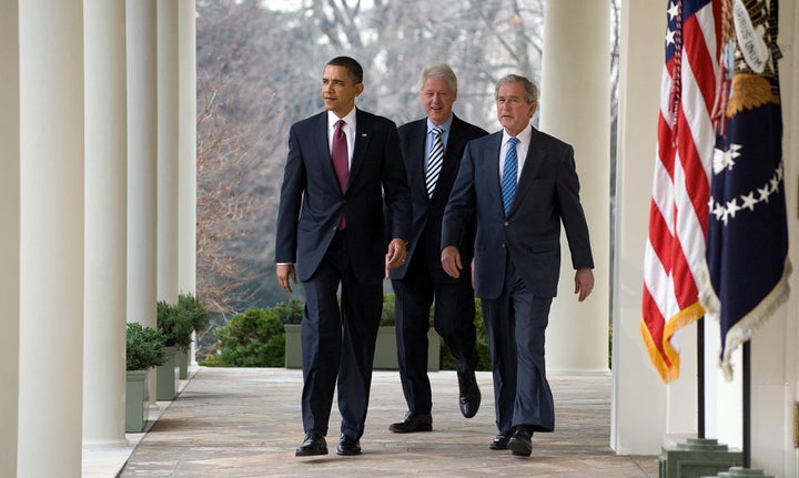 Former President Barack Obama walks through the West Wing's colonnate along with former presidents Bill Clinton and George W. Bush in 2010.