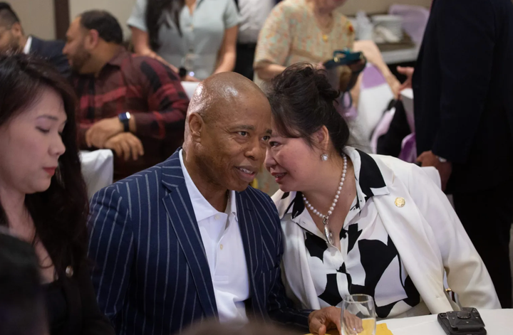The City Council Asian Affairs Advisor, Winnie Greco, speaks with Mayor Eric Adams at a community event in Flushing, May 31, 2023.