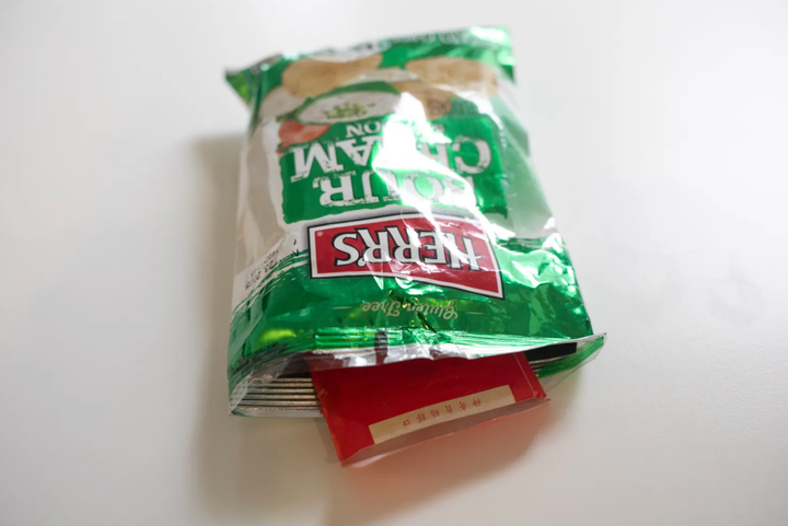 Eric Adams Advisor Handed Reporter Money Stuffed In Bag Of Potato Chips 1 Former City Hall aide Winnie Greco handed THE CITY reporter Katie Honan an opened potato chip bag containing an envelope full of cash after a reelection event for Mayor Eric Adams in Harlem, Aug. 20, 2025.